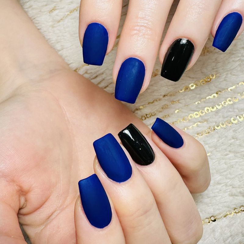 Matte navy blue with one glossy black nail