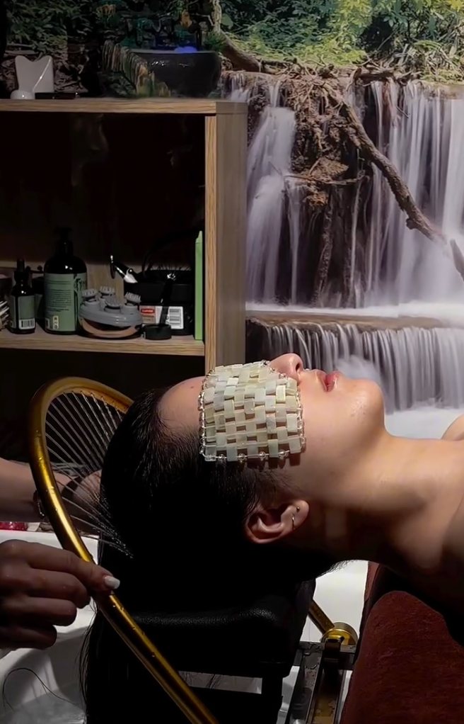 Client enjoying a Head Spa treatment at Kim Nails, relaxing eye mask