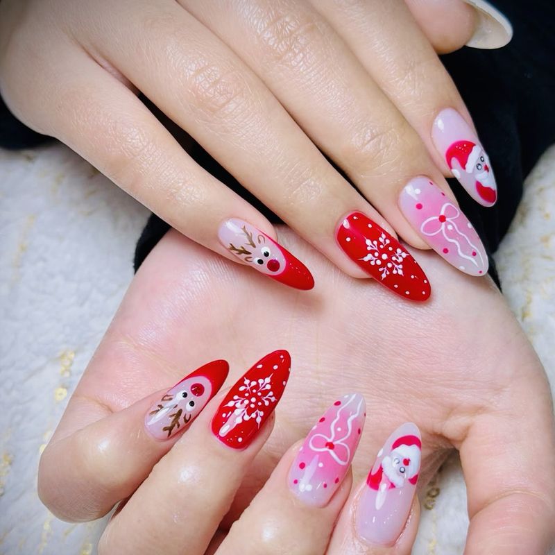 Christmas nail art with Santa, a reindeer and snowflakes