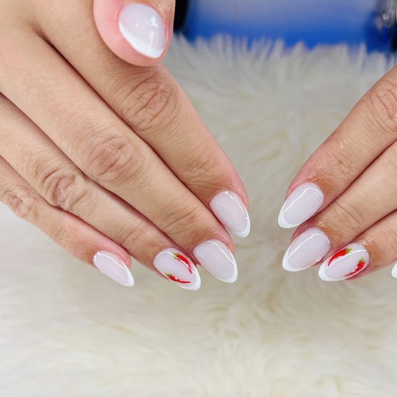 White French tips with hand-painted red chillies